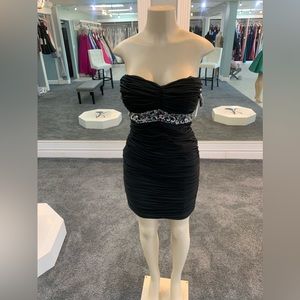 Size 8. Black.  sparkle waist.  strapless gown. fully ruffle